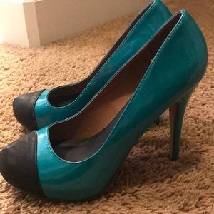 Michael Antonio Teal and Black Pumps
